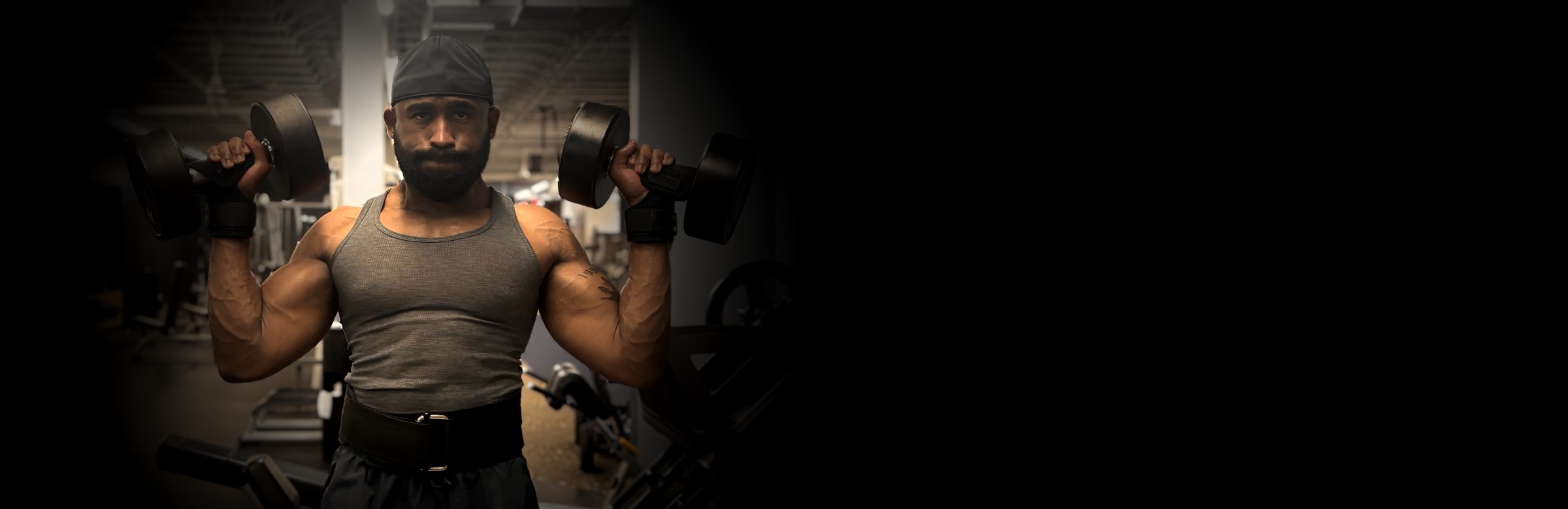 Coach Rashad pressing dumbbells