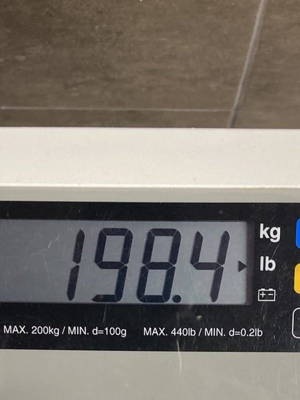 A scale reading 198.4 pounds in August 2021